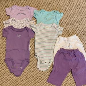 Set of 5 Carters bodysuits bundled with 2 coordinating pairs of pants.